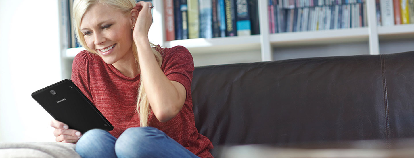 Woman Using Samsung Galaxy Tab S2 NOOK Woman Using Samsung Galaxy Tab S2 NOOK